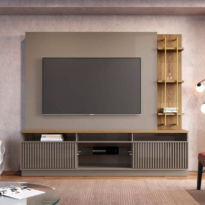 a flat screen tv mounted to the side of a wall