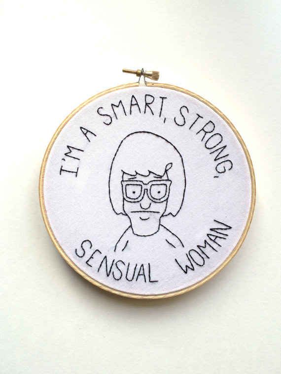 a white embroidery hoop with the words i'm a smart strong woman on it