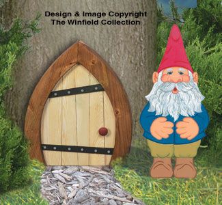 two gnomes are standing next to a tree