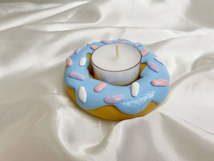 a candle that is sitting in a doughnut