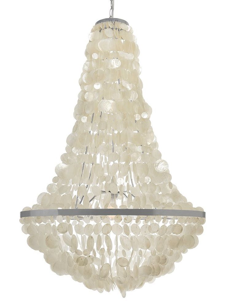 a white chandelier hanging from the ceiling with shells all over it's surface