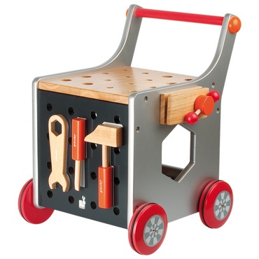 a wooden toy car with tools on the front and red wheels, sitting on a white background