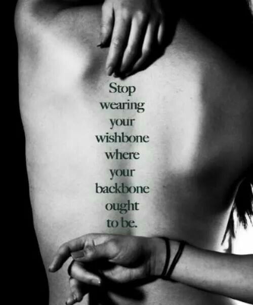 a woman's back with the words stop wearing your wishbones