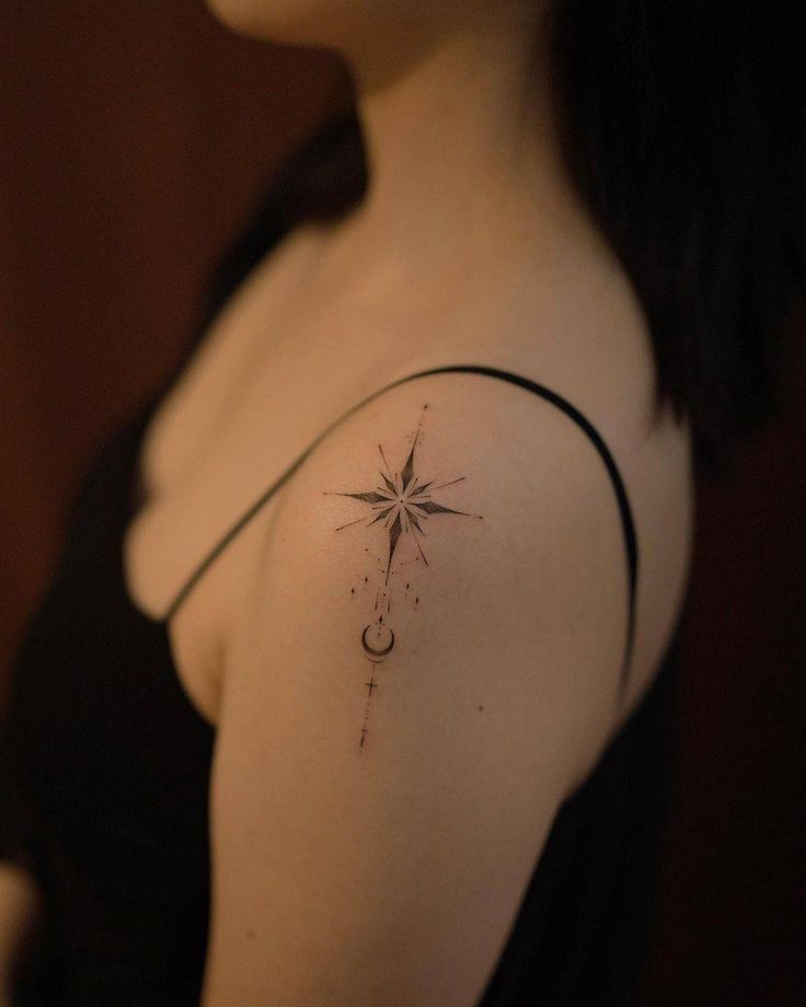 a woman with a star tattoo on her shoulder