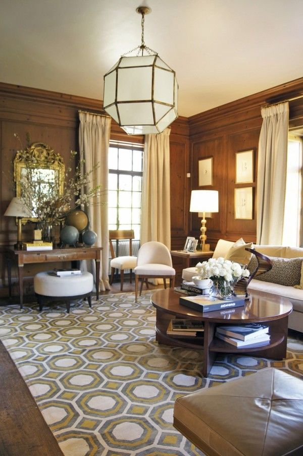 a living room filled with furniture and a chandelier