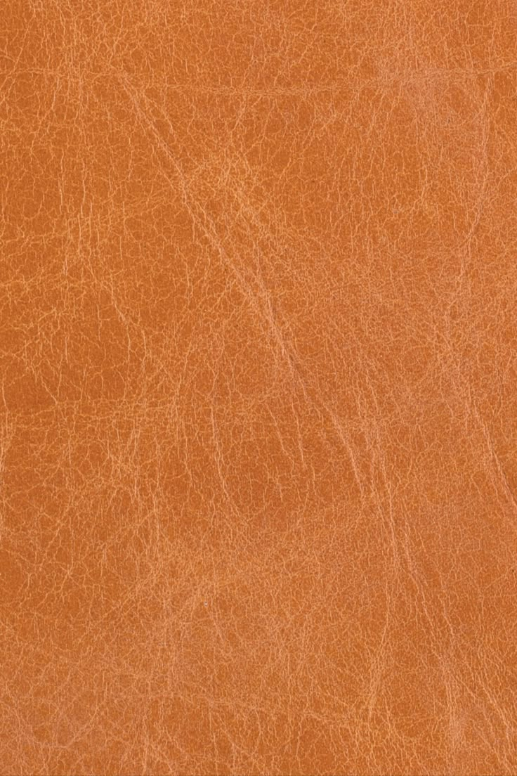 an orange leather texture background or wallpaper