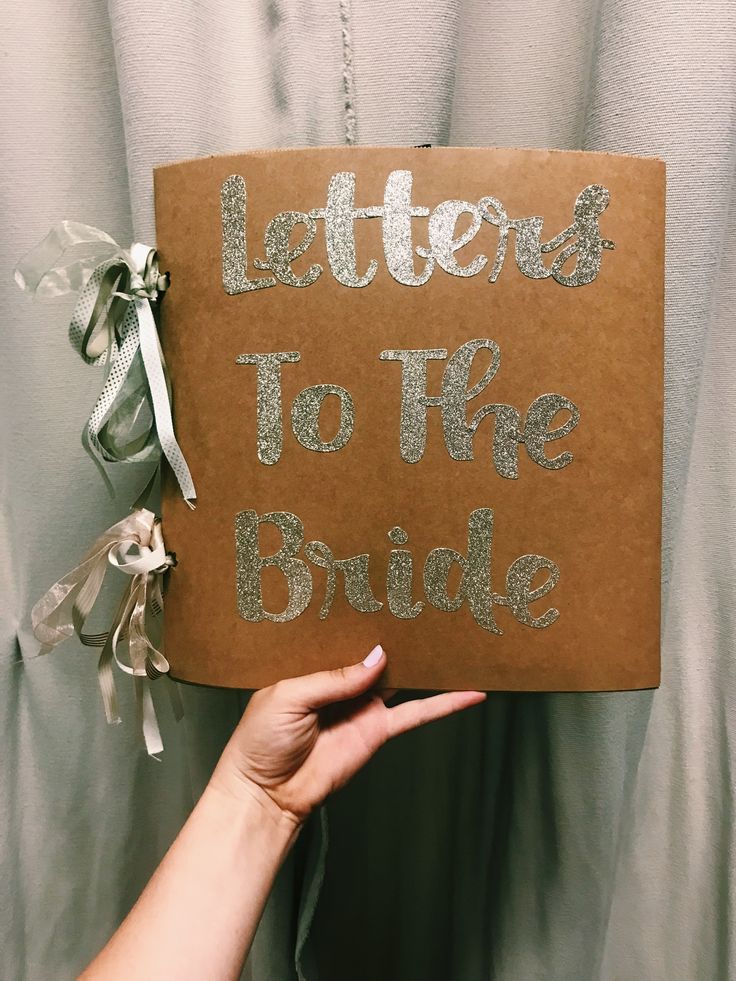 someone holding up a sign that says letters to the bride