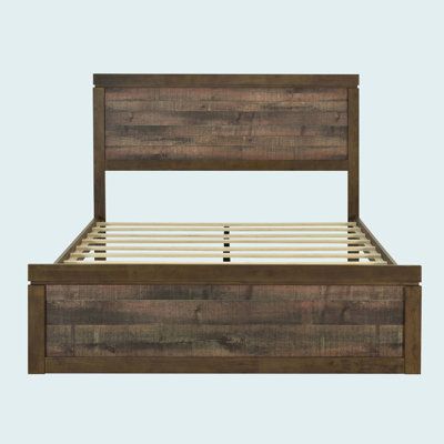 the bed frame is made out of wood and has two wooden slats on each side