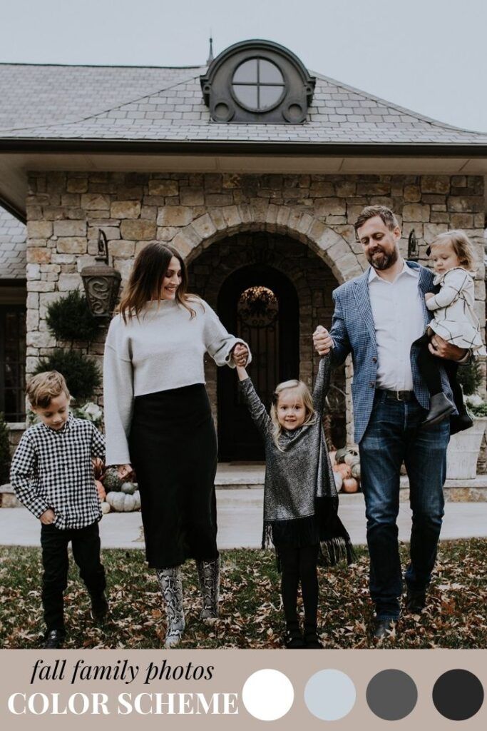 a family holding hands and walking in front of a house