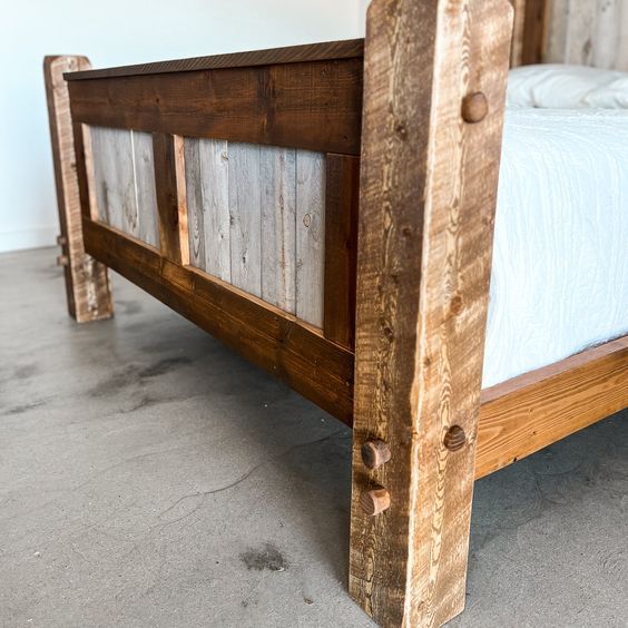 a bed frame made out of wooden planks