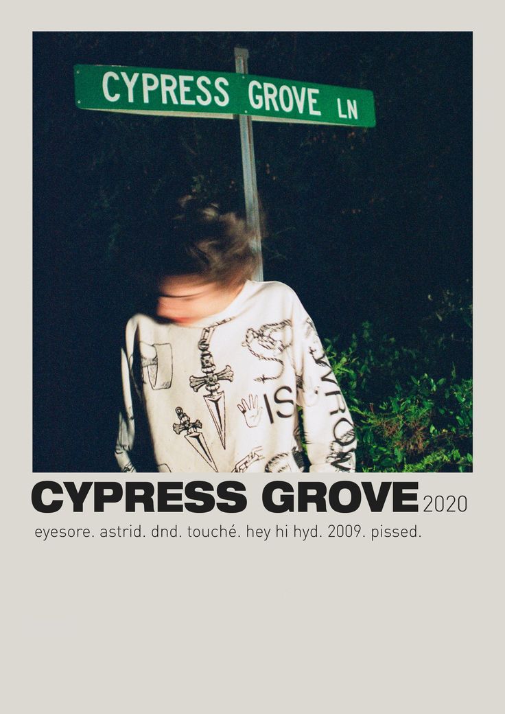 a person standing under a street sign that says cypress grove in front of them and the words cypress grove on it