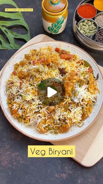 a plate full of food sitting on top of a wooden cutting board next to spices and seasonings