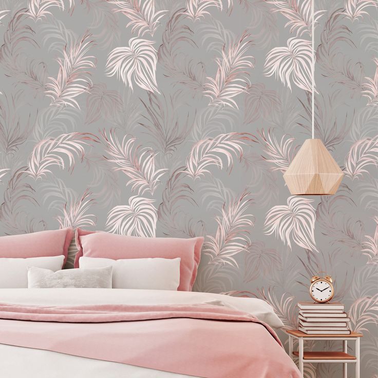 a bedroom with pink and grey wallpaper