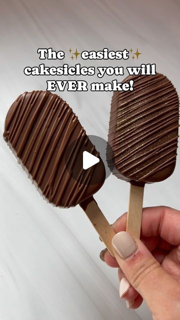 someone is holding two chocolate lollipops with the words, the easyest cakesicles you will ever make