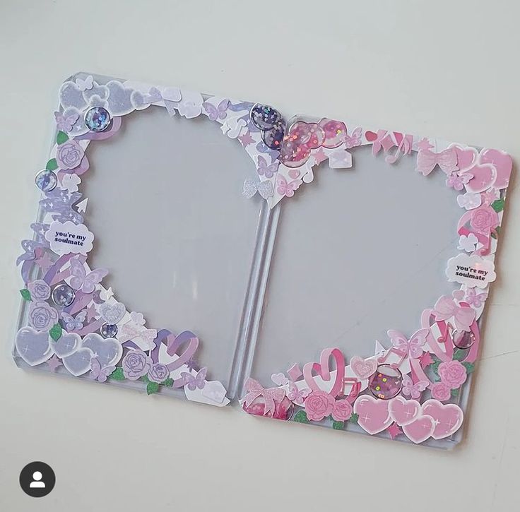 a photo frame with flowers and hearts on it