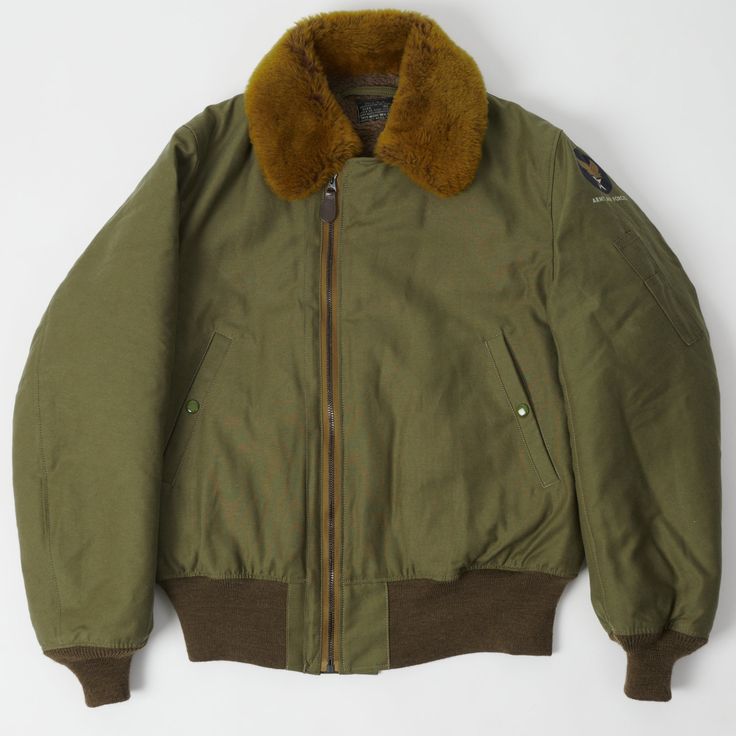 This B-15 Flight Jacket from Toys McCoy has been cut from a rare blend of cotton and rayon, which gives the surface a unique neppy feel. This fabric provides a water resistant covering, while a thermal membrane has been used for the interior lining. For added warmth, a full alpaca lining has been featured, including the sleeves, and a shearling collar has been added to complete the look of this timeless piece of military history. This short cut, and boxy shaped jacket has been fitted with knitte 80s Clothes, Supernatural Dr, Short Sleeve Jacket, 80s Outfit, Army Jacket, Short Cut, Flight Jacket, Reference Photos, Military History