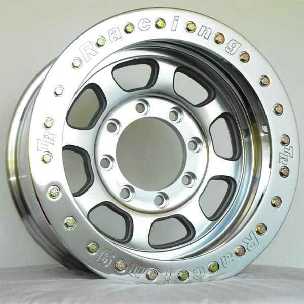 an aluminum wheel with rivets on the rim