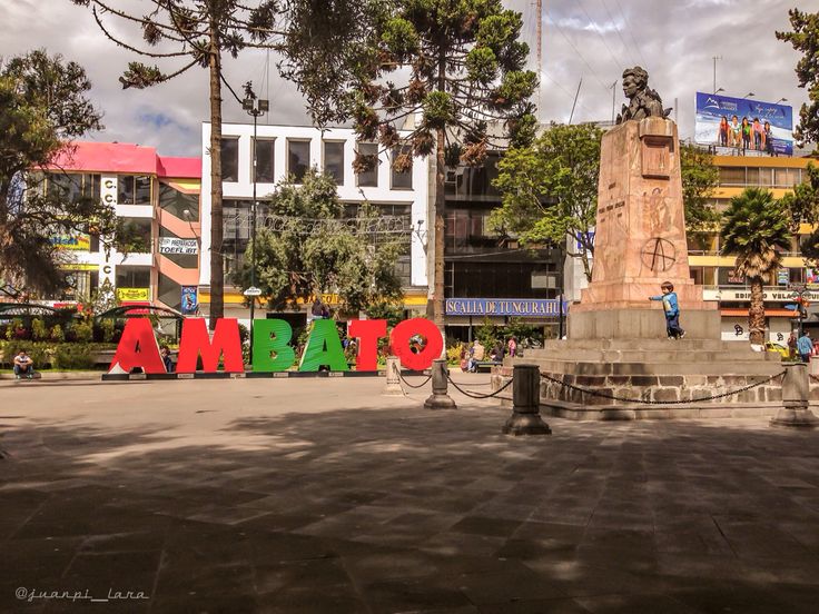 there is a large sign that says amama in the middle of a city square