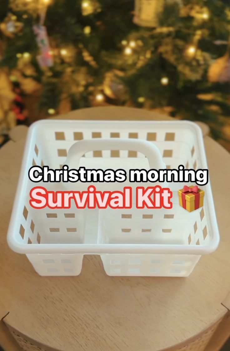 a christmas morning survival kit sitting on top of a table next to a christmas tree