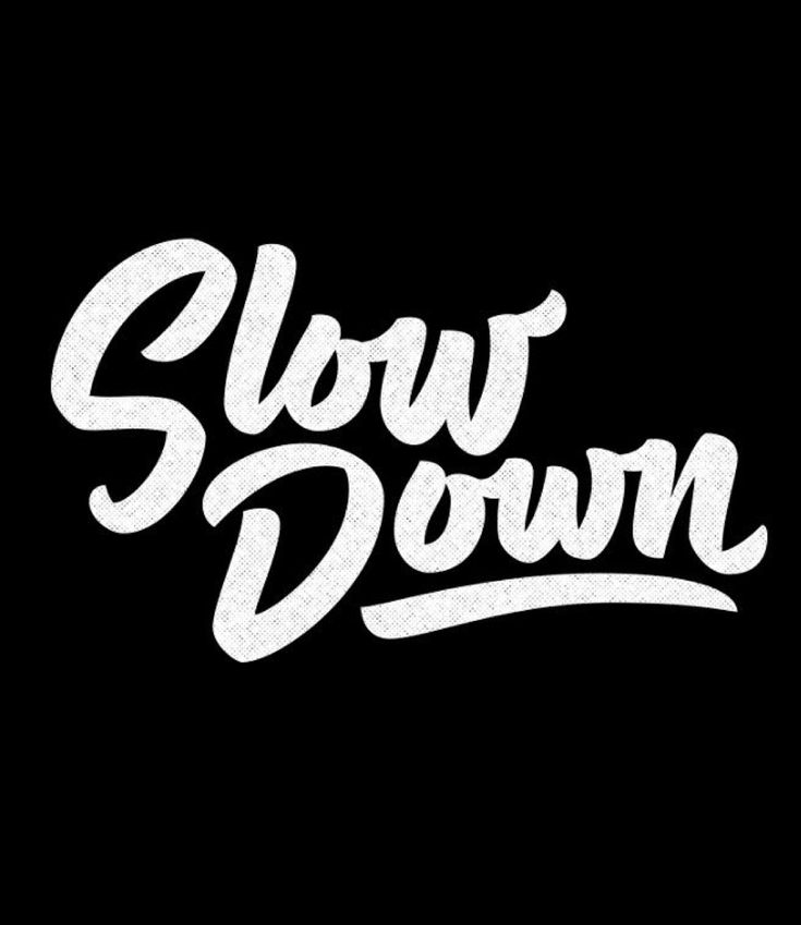 the word slow down written in white on a black background