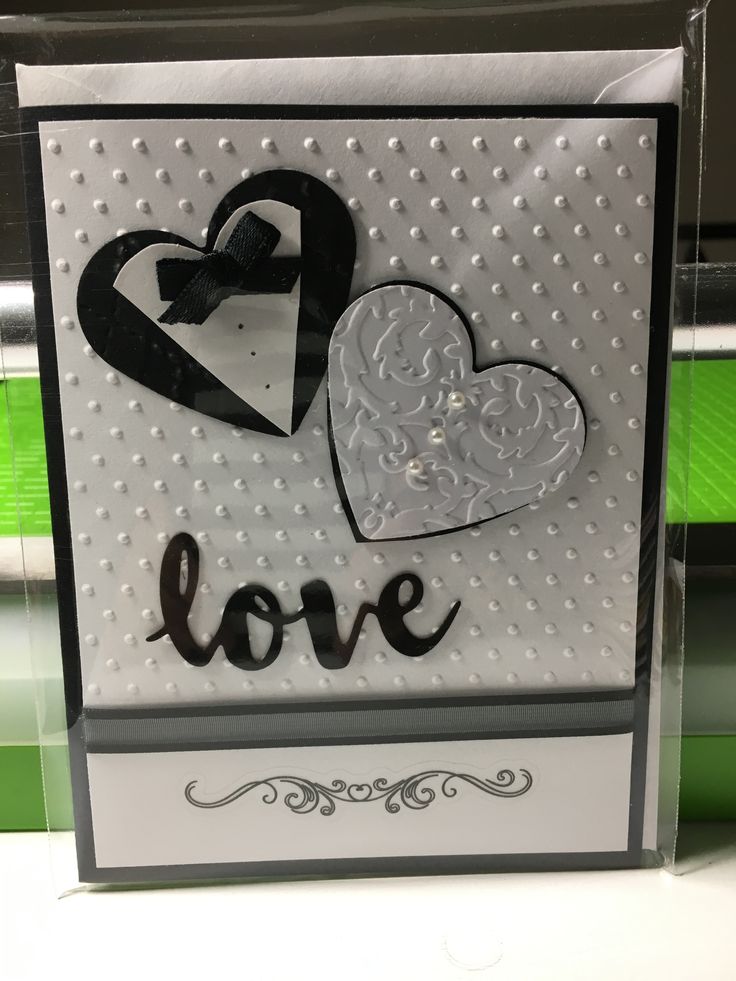 a card with two hearts and the word love