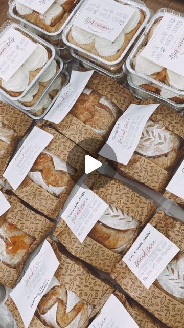 several trays filled with different types of pastries on top of each other,