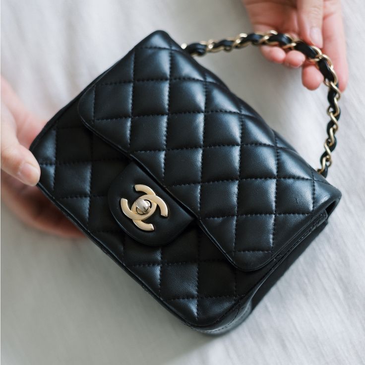 2019 Chanel Mini Square Classic Flap - Black Lambskin The Modernized Chanel Mini Square Classic Flap Bag Has Become One Of The Most Coveted And Sought After Chanel Styles. This Particular Bag Is Only 3 Years Old Is In Great Condition. Details: Width: 6.5 In Depth: 2.5 In Height: 5.5 In Chain Strap Drop: 20 In. Condition: Great Condition. Rubbing And Signs Of Wear On Corner Edges. Some Scuffs In Interior Flap. Gold Hardware Is Showing Signs Of Tarnishing. Accessories: Comes With Chanel Dust Bag. Black Double Flap Bag For Daily Use, Classic Black Flap Bag For Shopping, Chic Black Double Flap Bag, Luxury Everyday Black Shoulder Bag With Cc Turnlock, Black Flap Bag With Cc Turnlock For Everyday Use, Luxury Everyday Black Flap Bag, Black Formal Bag With Cc Turnlock Closure, Formal Black Bag With Cc Turnlock Closure, Designer Black Flap Bag For Everyday Luxury