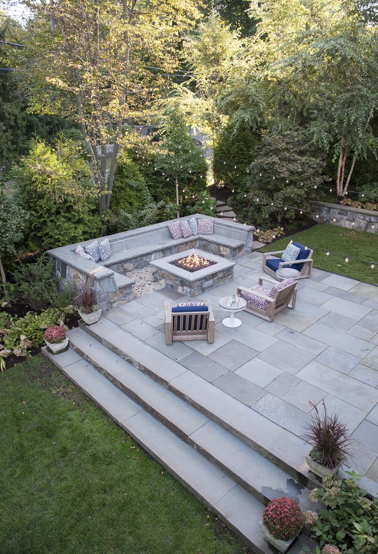 a fire pit sitting on top of a stone patio