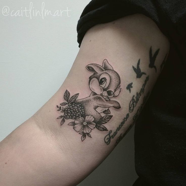 a person with a tattoo on their arm