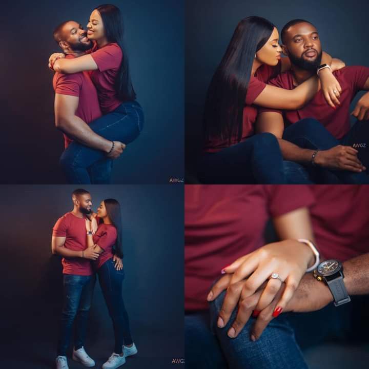 two people hugging each other while posing for pictures