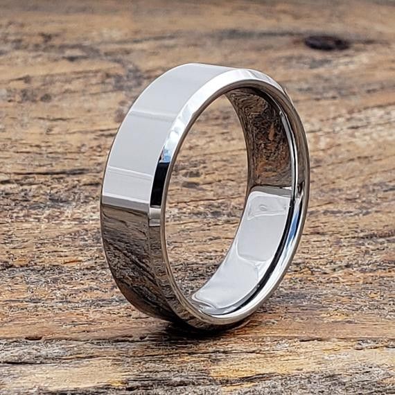 a wedding ring with a wooden inlay