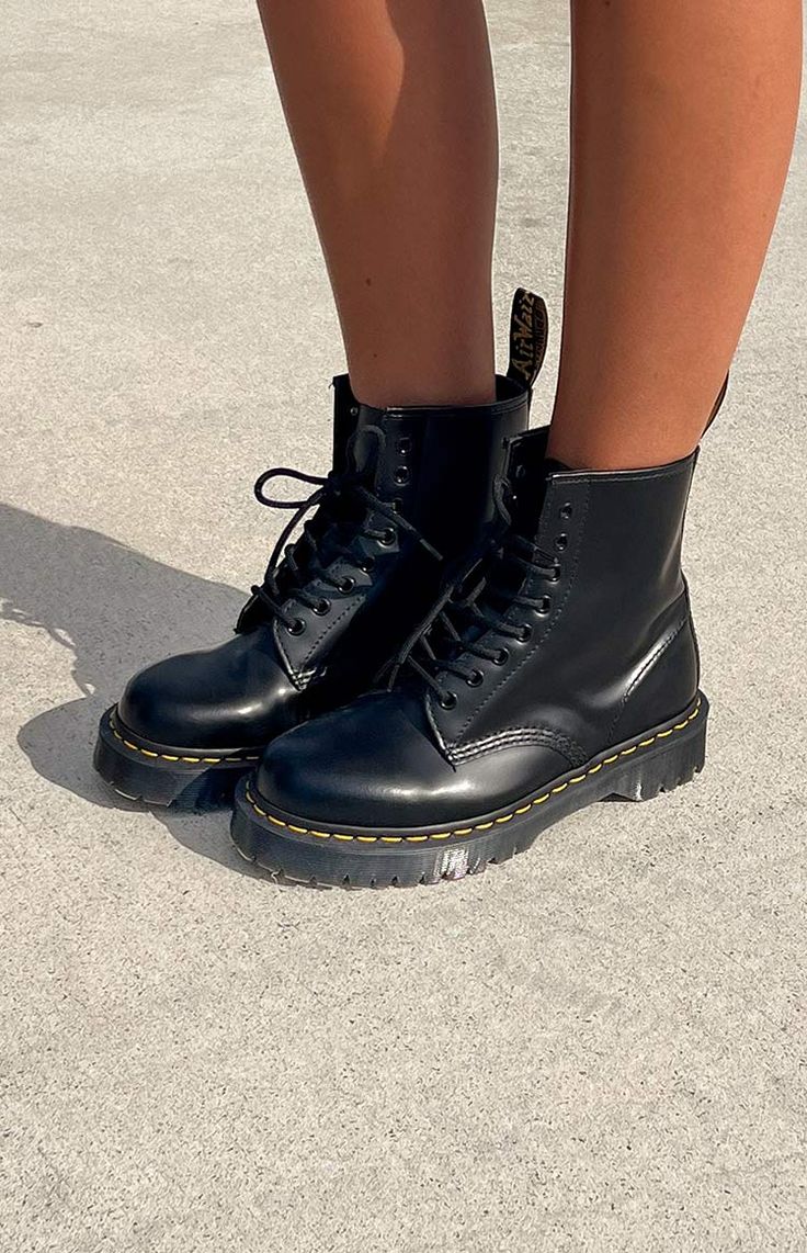 * Black Boot by Dr Martens () 
 * This staple boot will be your go - to shoe () all year round! Style with a black mini for a grungy/cool girl look or simply wear with jeans and a blazer for a cool winter-y look! 
 * Pull tab for easy entry 
 * Lace up fastening 
 * Chunky sole 
 * Yellow contrast stitching 
 * Round toe Dr Martens Bex, Doc Marten Boot, Prom Midi Dress, Shop Boots, Summer Playsuit, Crochet Sandals, Amy Rose, Beginning Boutique, Strapless Tops