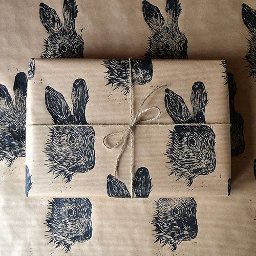 two wrapped presents with rabbits on them