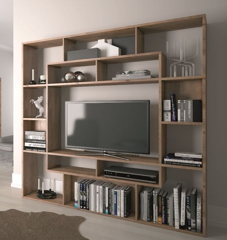 an entertainment center with bookshelves and a television