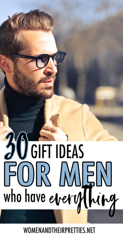 a man wearing sunglasses and holding a sign that says, 20 gift ideas for men who have everything