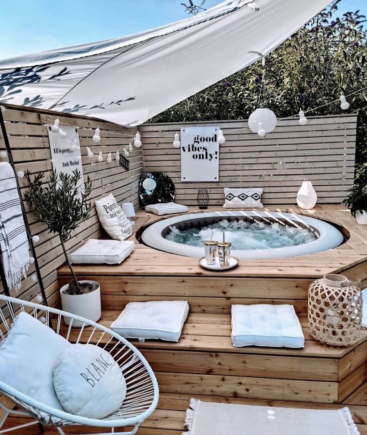 a hot tub sitting on top of a wooden deck