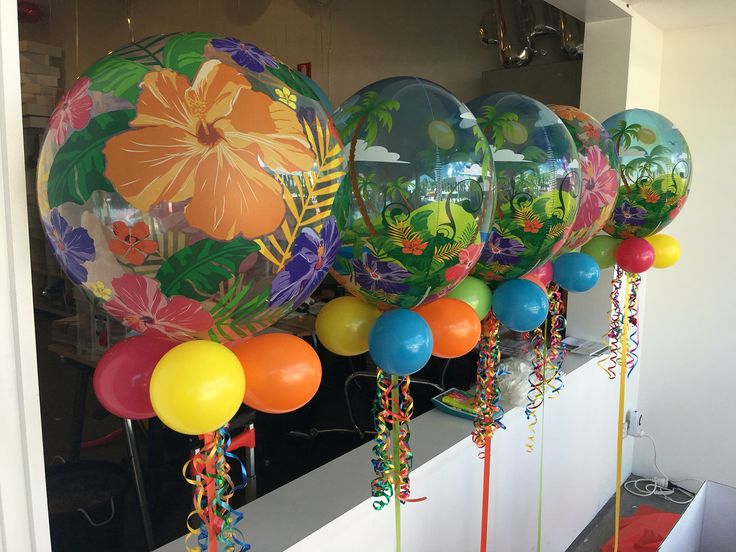 many balloons are lined up on the wall