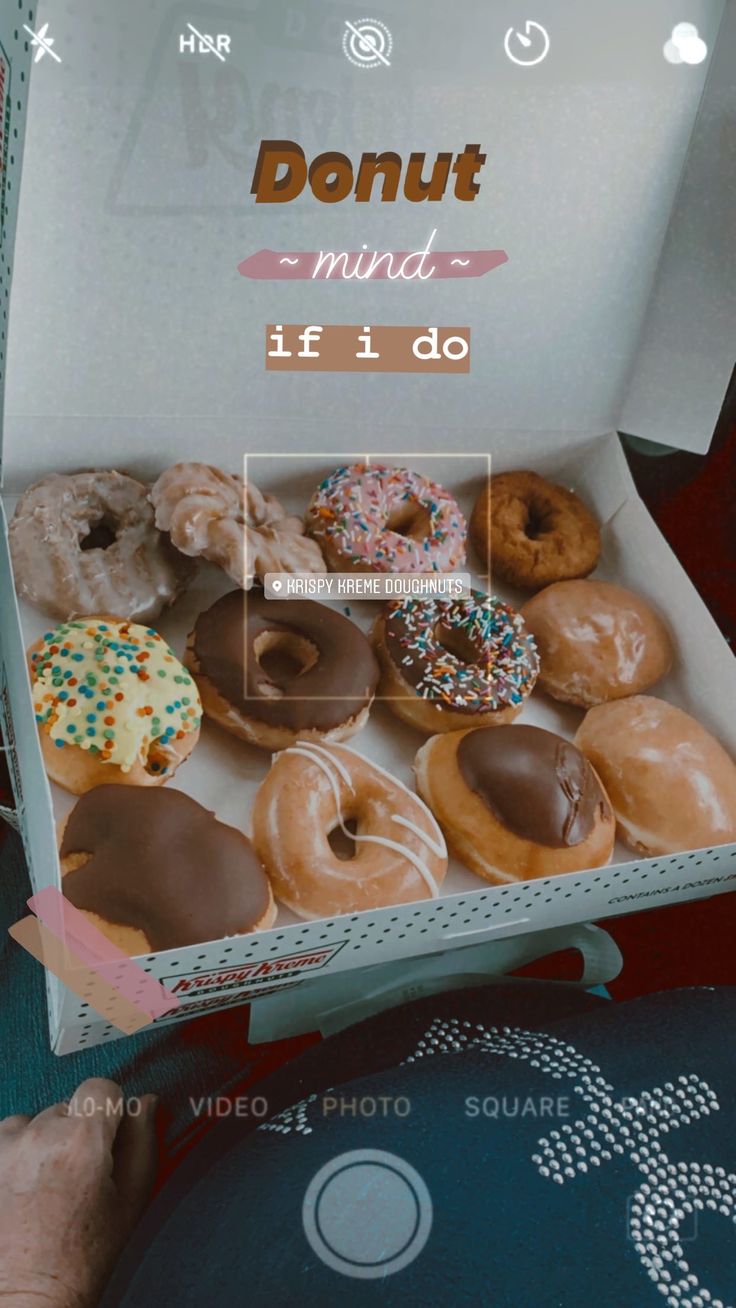 a box filled with lots of different flavored donuts