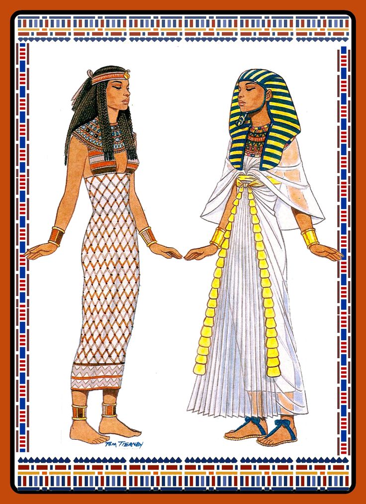 two women dressed in egyptian clothing, one wearing a headdress and the other holding hands