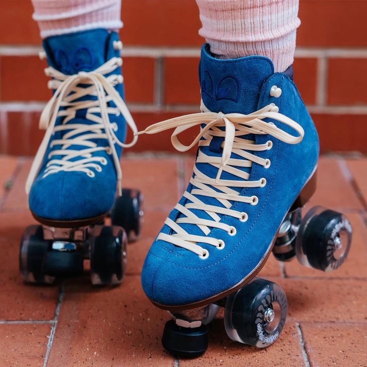 a pair of blue roller skates with white laces