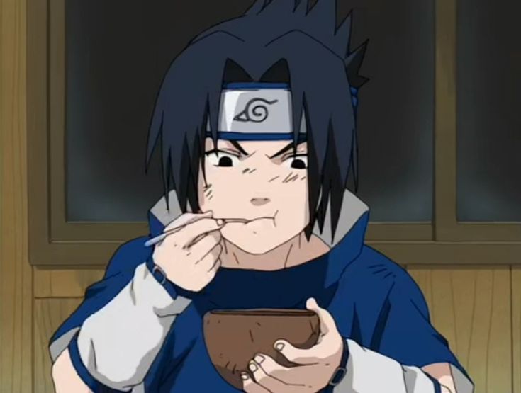 a man with black hair eating food from a bowl