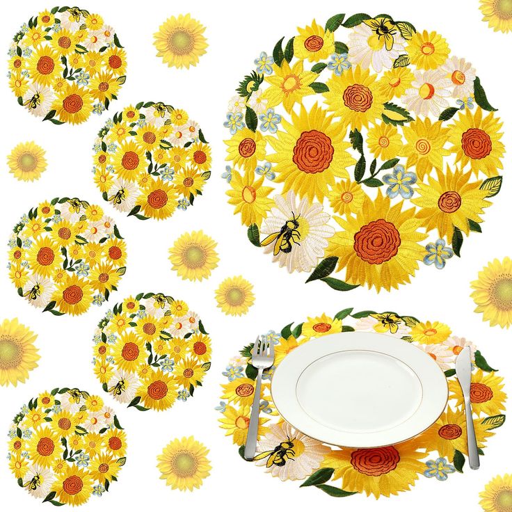 sunflowers and daisies are arranged around a white plate