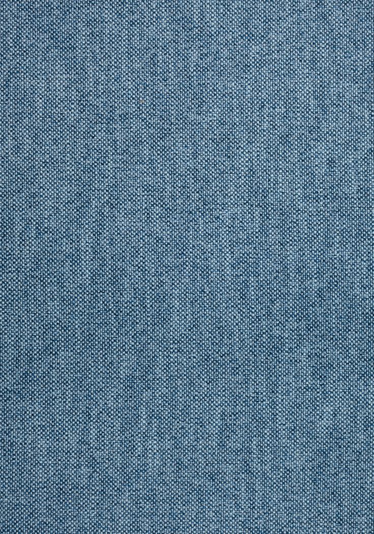 blue denim fabric textured with small holes in the middle and one patch at the top