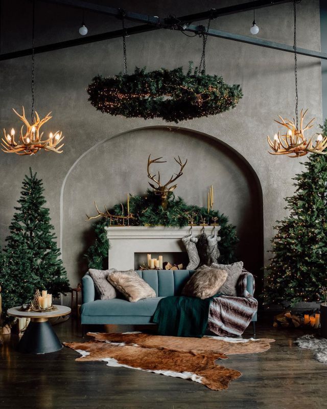 a living room filled with furniture and christmas trees