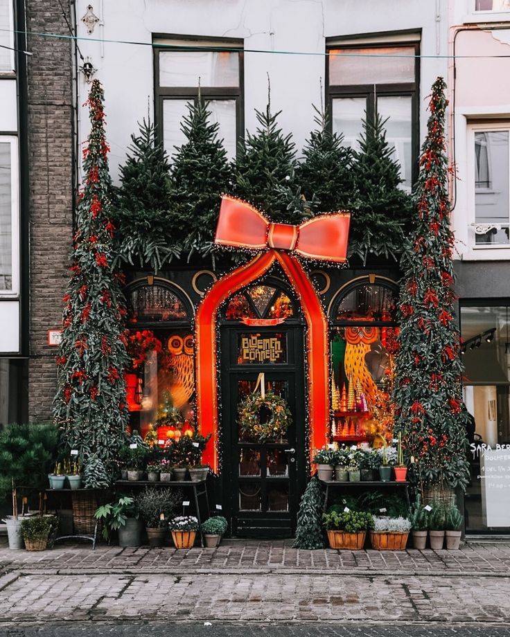 an entrance to a building decorated for christmas