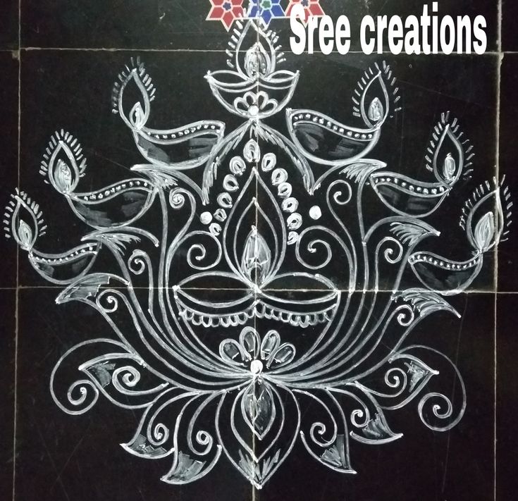 an intricately designed tile with the words free creations written in white chalk on it