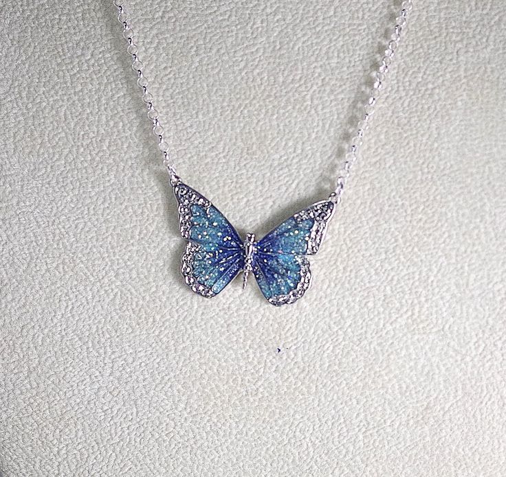 Pretty enamel and imitation rhodium-plated, 35x25mm single-sided butterfly - shown here in blue and green with glitter (6 color choices - see photos). Necklace is made with silver filled rolo chain with a lobster clasp - select length during checkout. Comes in a gift box. Photos - 1, 2, & 3 = Blue and Purple Photo 4 - Black Photo 5 - Green Photo 6 - Orange Photo 7 - Pink Photo 8 - Purple Orange Photo, ليلو وستيتش, Purple Photo, Butterfly Necklace Silver, Pretty Jewelry Necklaces, Black Photo, Pink Photo, Green Photo, Magical Jewelry