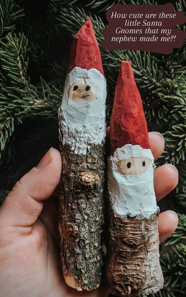 someone is holding two logs made to look like santa claus and the caption says, how cute are these gnomes that my mother made me?