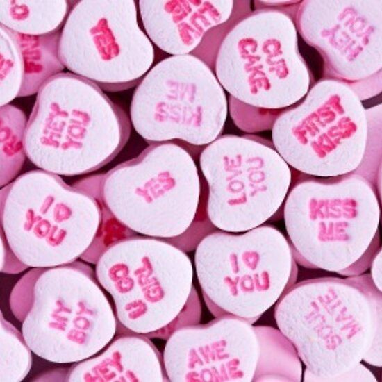 pink candy hearts with the words i love you written on them in different languages and colors