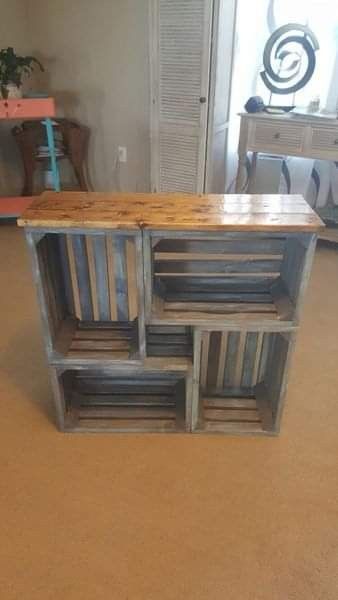 a wooden table sitting in the middle of a living room